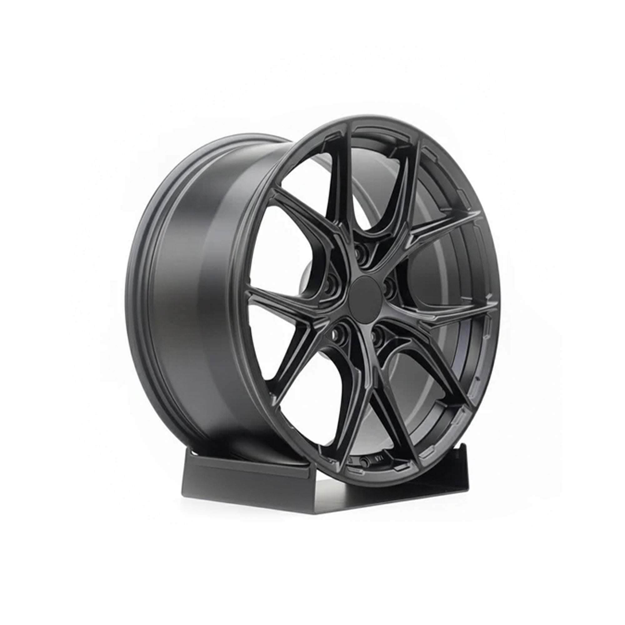 Black WWC P-Series Multi-Spoke Flow-Form Wheel by WheelWork Customs, showcasing sleek design and detailed spoke pattern.