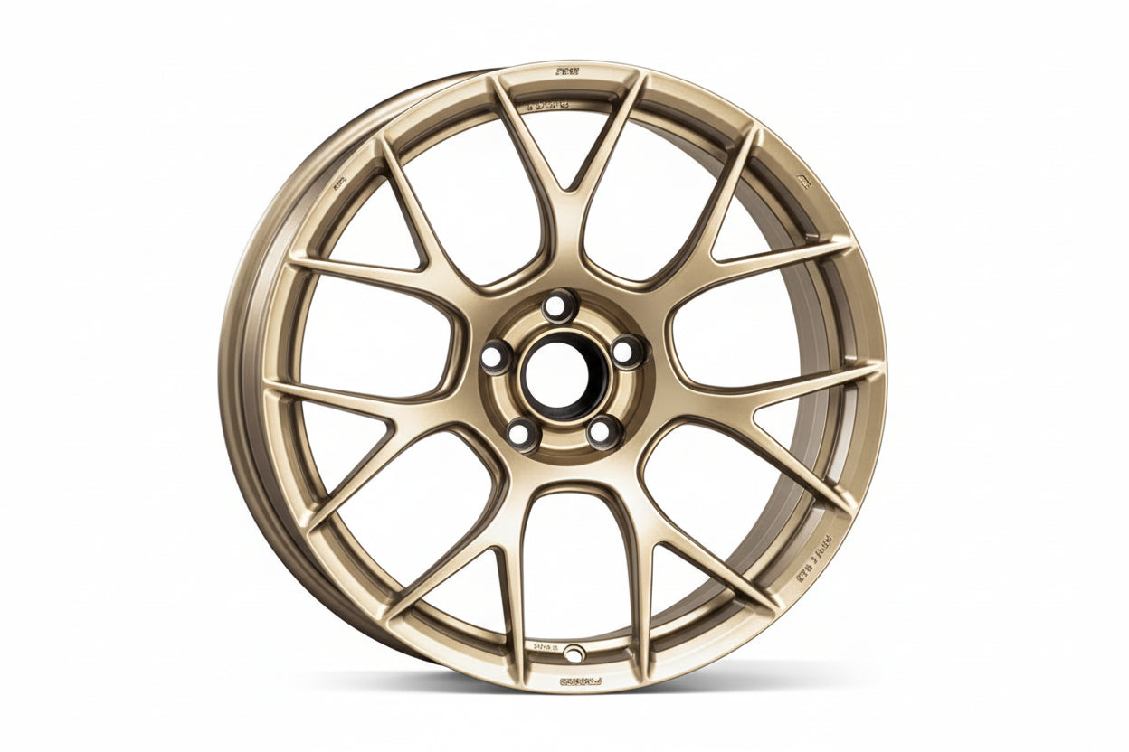 Custom forged WWC REV-7 7-spoke performance wheel by WheelWorkCustoms, showing a sleek, durable alloy wheel design.