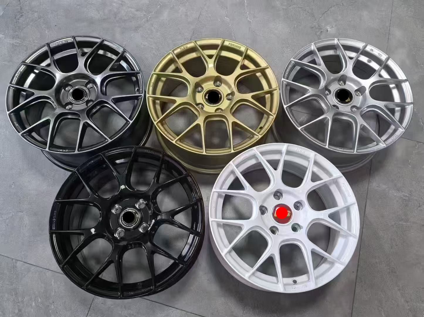 Silver WWC RV7 7-cross-spoke flow form wheel by WheelWork Customs, showcasing its sleek design and metallic finish.