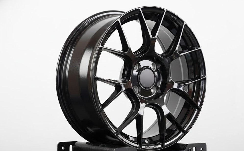 Black WWC RV7 7-cross-spoke flow form wheel by WheelWork Customs, showcasing sleek multi-spoke alloy design.