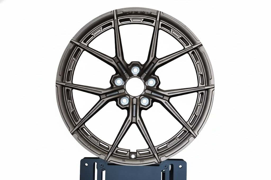 Bronze WWC VFX split-spoke flow-form wheel by WheelWorkCustoms, showcasing its sleek design and detailed spoke pattern.