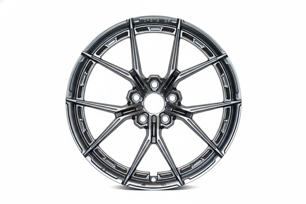 Gunmetal grey WWC VFX split-spoke flow-form wheel by WheelWorkCustoms, showcasing its sleek design and modern style.