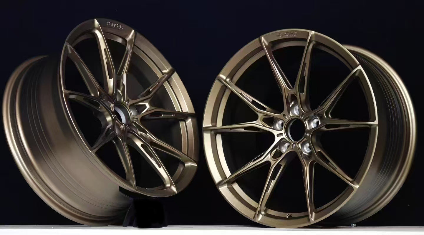 Custom forged WWC VORTEX-6 lightweight performance wheel by WheelWorkCustoms showing sleek, aerodynamic design and metallic finish.