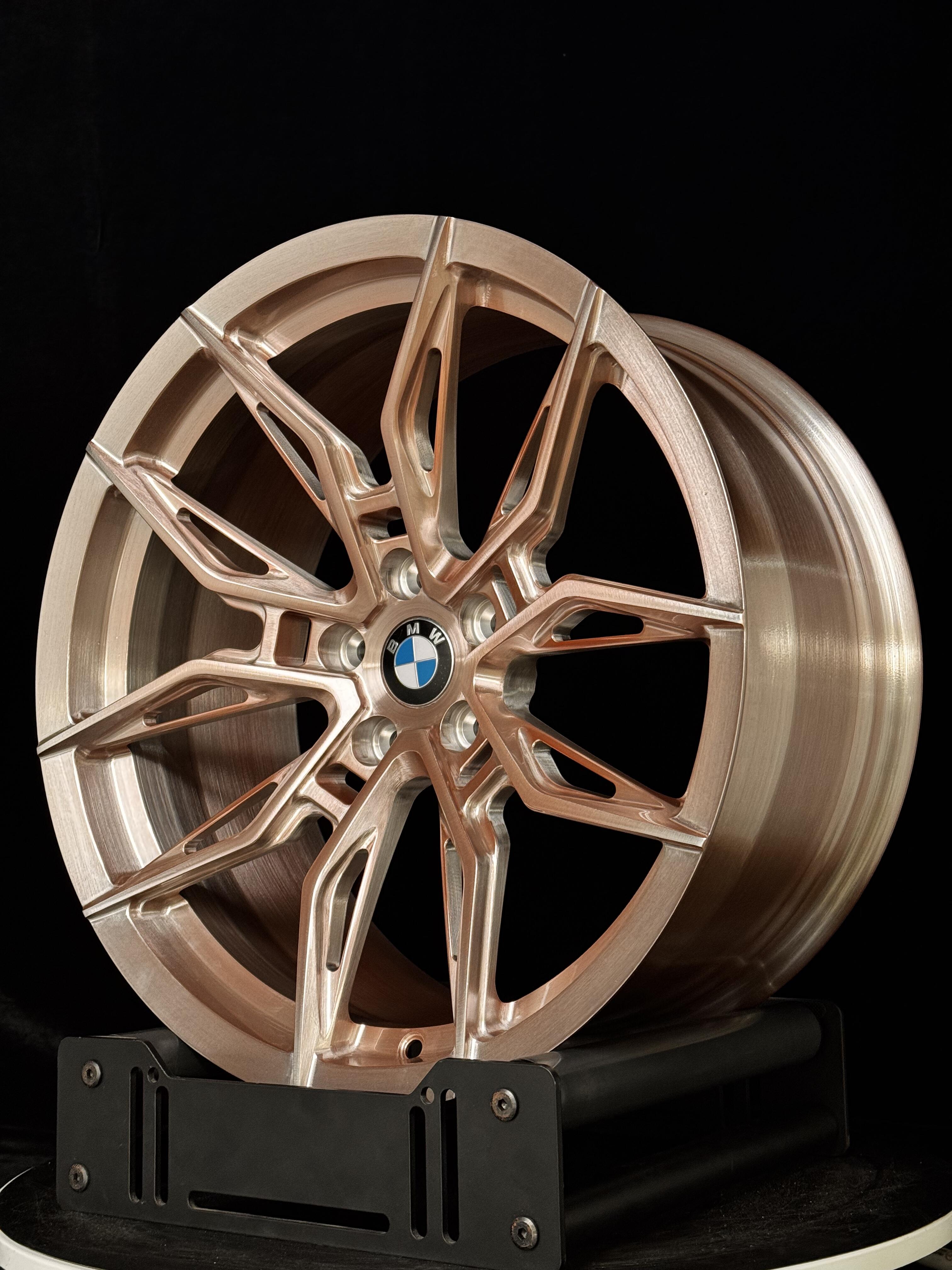 Custom forged WWC 1000M lightweight performance wheel with a sleek, sport-inspired design, displayed on a car for motorsport style.