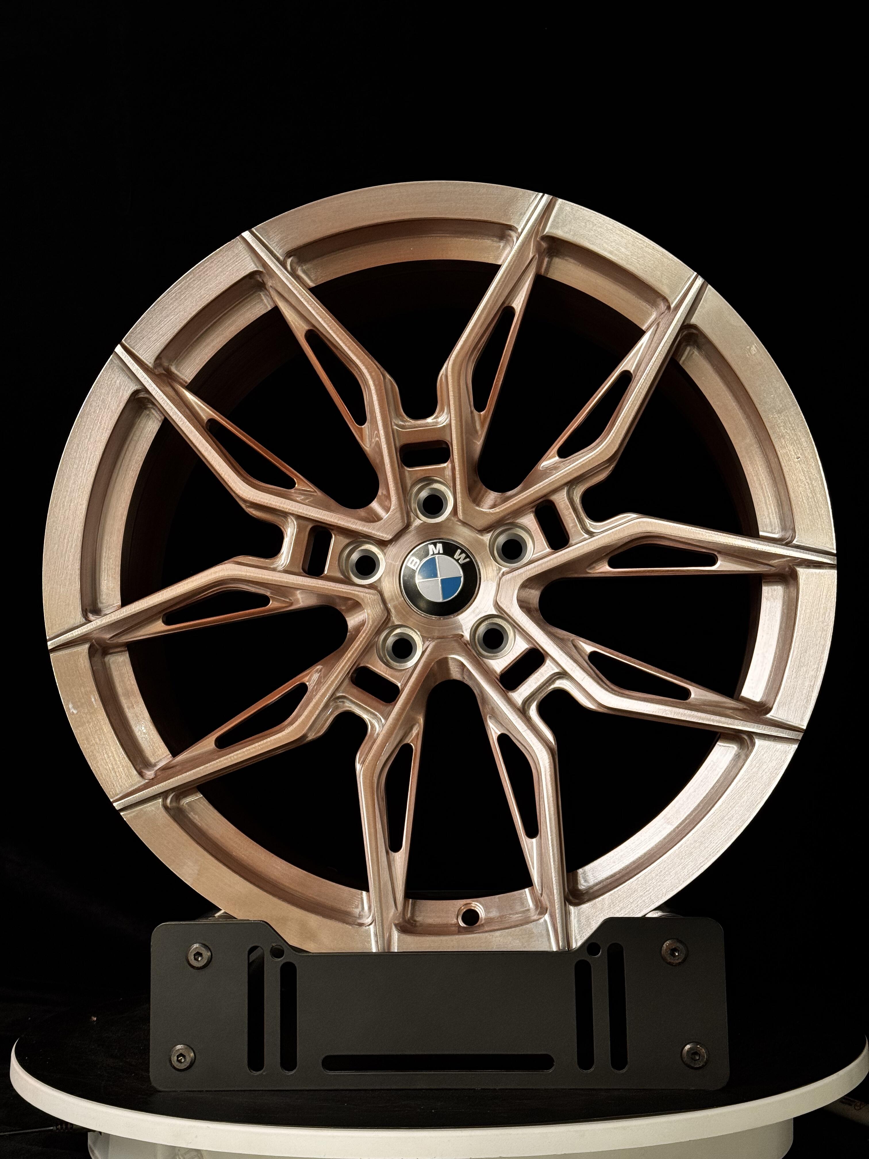 Lightweight custom forged WWC 1000M Motorsport style performance wheel by WheelWorkCustoms, featuring sleek design and high-quality finish.