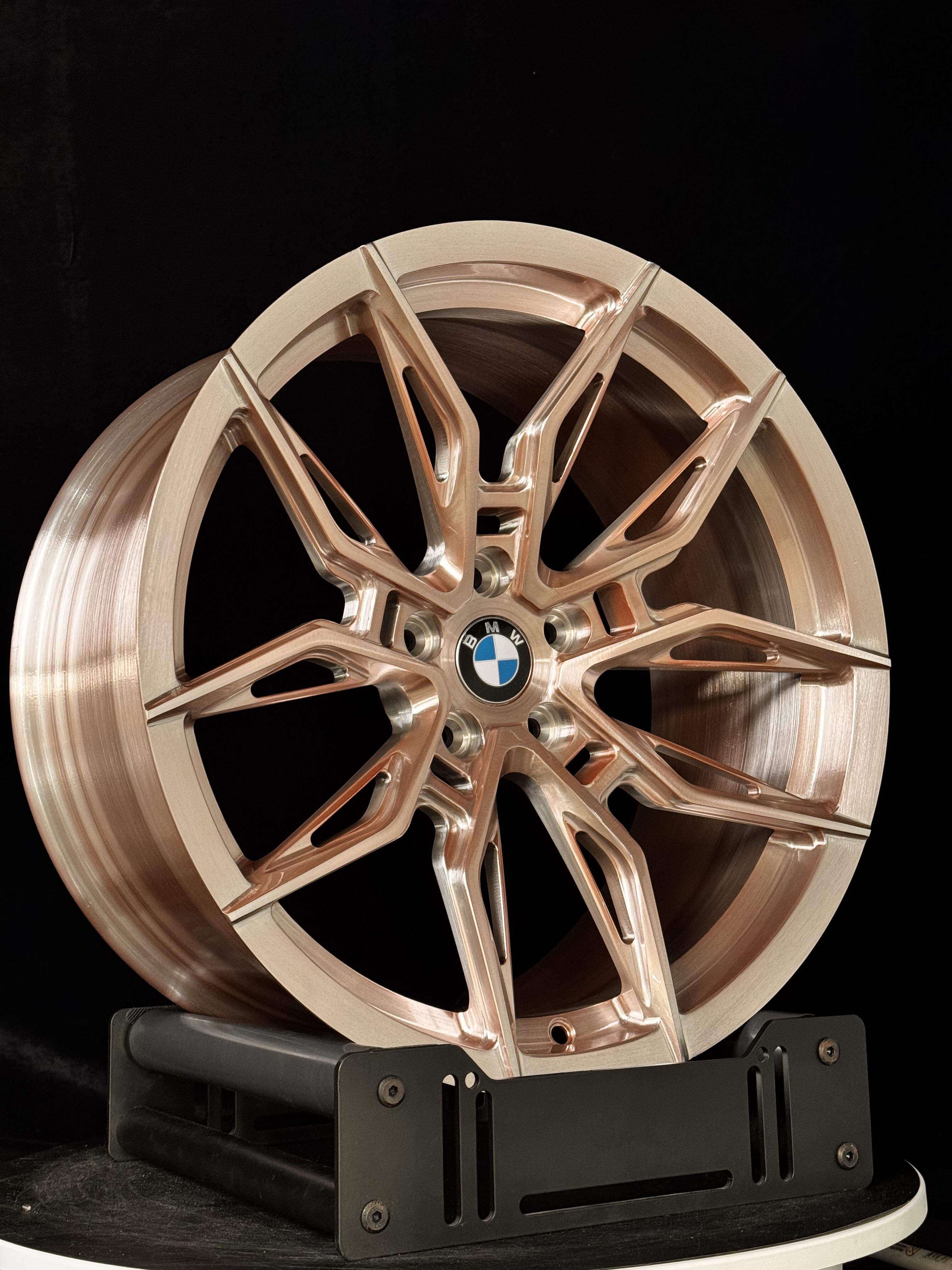 Custom forged WWC 1000M lightweight performance wheel for motorsport, showing its sleek, durable design and unique finish.