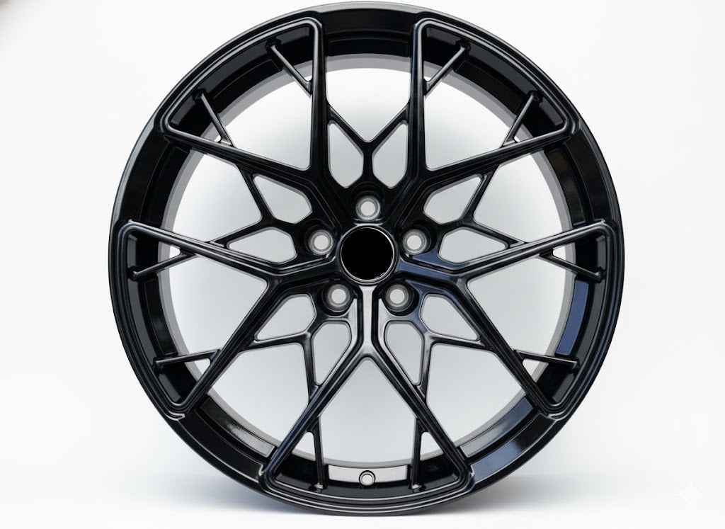 Black WWC FF10 multi-spoke flow-form wheel by WheelWorkCustoms, showcasing sleek, high-performance automotive wheel design.