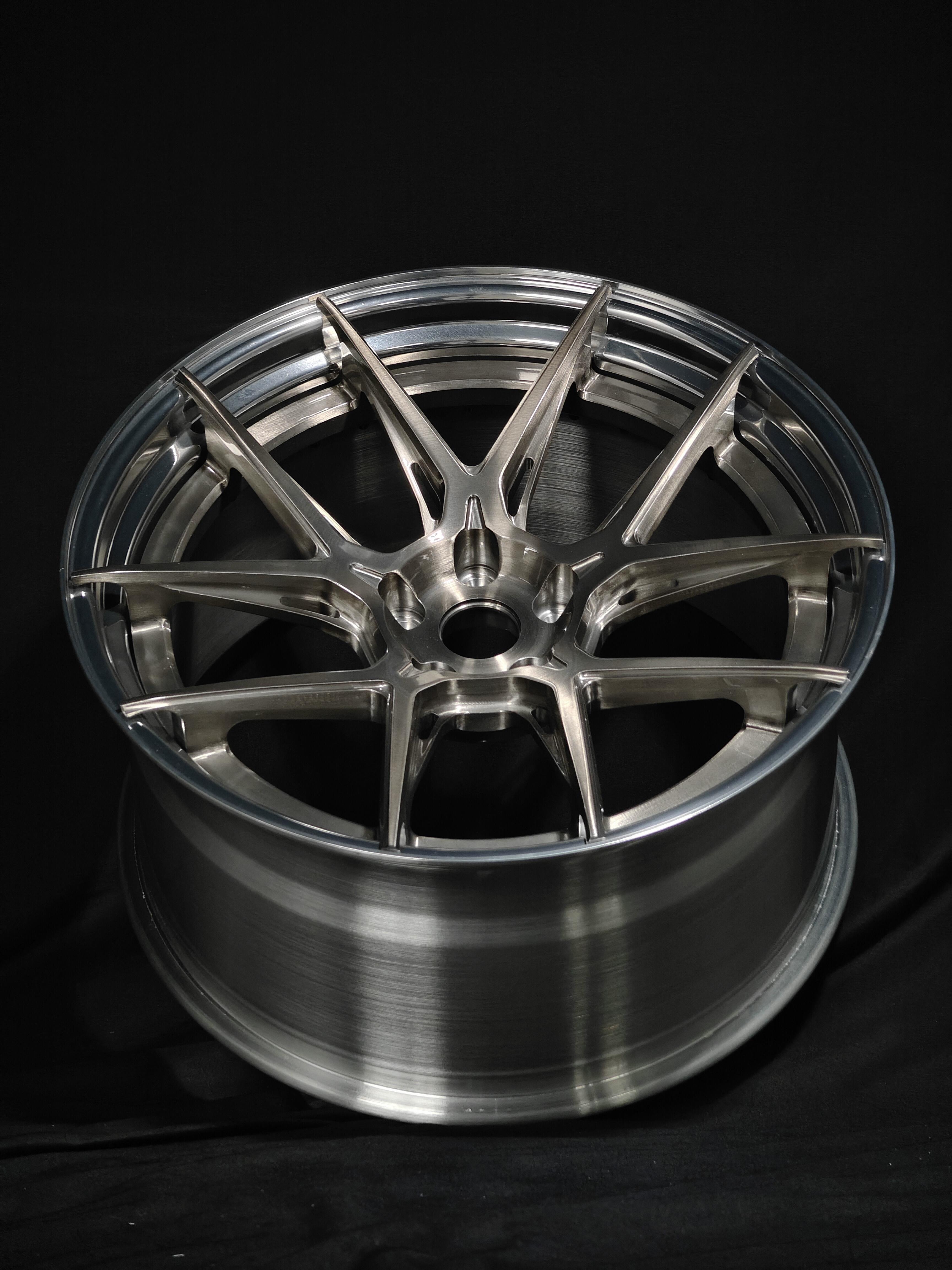 Custom forged WheelWorkCustoms WWC Velocity GT lightweight performance wheel with a sleek metallic finish and intricate spoke design.