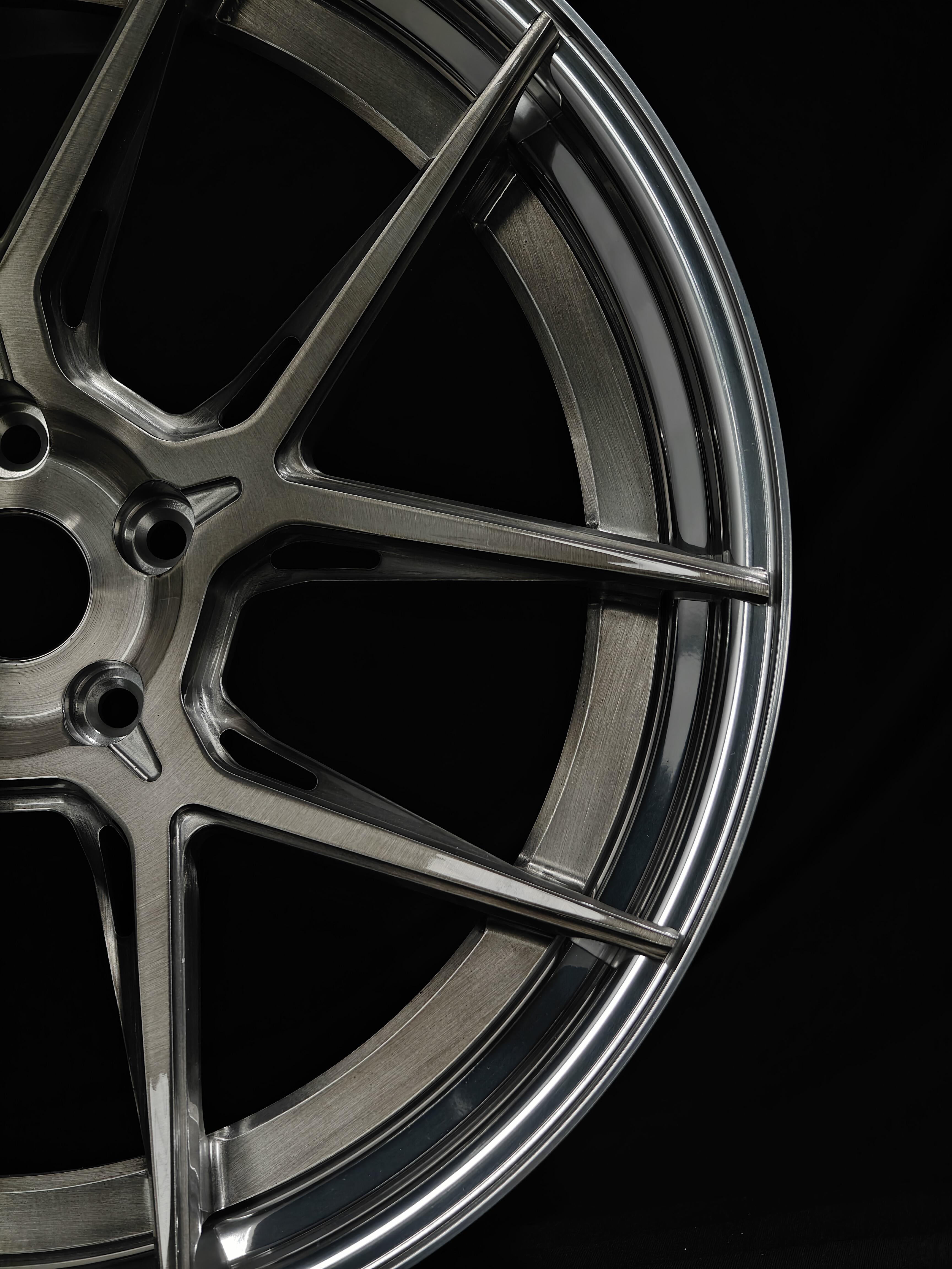 Custom forged WheelWorkCustoms Velocity GT lightweight performance wheel with a sleek black finish and multi-spoke design.